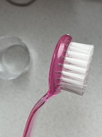 Ergonomische Staubbürste rund rosa